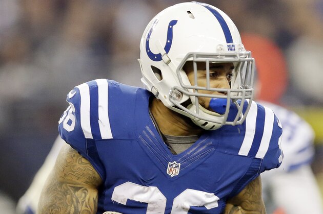 Indianapolis Colts running back Dan Herron (36) carries the ball during the first half of an NFL football game against the Dallas Cowboys, Sunday, Dec. 21, 2014, in Arlington, Texas. Dallas won 42-7. (AP Photo/Tim Sharp)