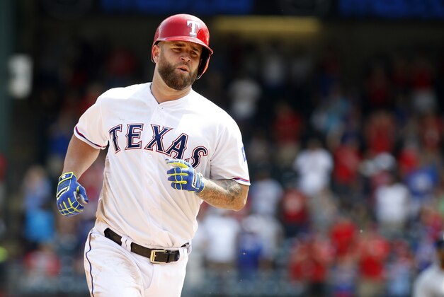 Aug 19, 2015; Arlington, TX, USA;  Texas Rangers first baseman Mike Napoli (25) rounds the bases after hitting his 200th home run in the seventh inning against the Seattle Mariners at Globe Life Park in Arlington. Texas won 7-2. Mandatory Credit: Tim Heitman-USA TODAY Sports