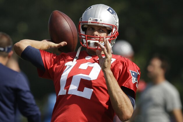 New England Patriots quarterback Tom Brady winds up for a pass during an NFL football practice in Foxborough, Mass., Wednesday, Aug. 26, 2015. (AP Photo/Steven Senne)