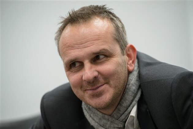 Dietmar Hamann and Hermann Gerland pose for a picture on the Training Grounds of FC Bayern Munich in Germany on Thursday, Feb. 13, 2014. (Sebastian Widmann/AP Images)