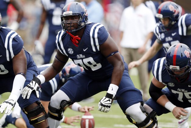 Mississippi offensive linesman Laremy Tunsil (78) steps into his blocking stance during pre-game warmups prior to an NCAA college football game against Louisiana-Lafayette at Vaught-Hemingway Stadium in Oxford, Miss., Saturday, Sept. 13, 2014. (AP Photo/Rogelio V. Solis)