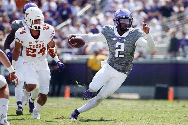 FORT WORTH, TX - OCTOBER 03:  Trevone Boykin #2 of the TCU Horned Frogs carries the ball against John Bonney #24 of the Texas Longhorns in the third quarter at Amon G. Carter Stadium on October 3, 2015 in Fort Worth, Texas.  (Photo by Tom Pennington/Getty Images)
