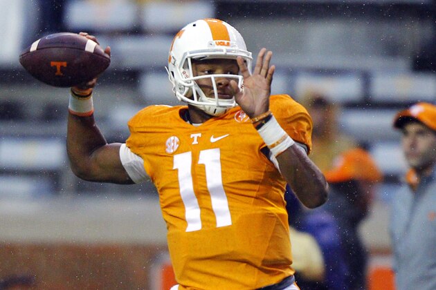 Tennessee quarterback Joshua Dobbs (11) throws to a receiver before the start of an NCAA college football game against Arkansas Saturday, Oct. 3, 2015, in Knoxville, Tenn. (AP Photo/Wade Payne)