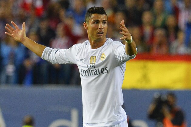 Real Madrid's Portuguese forward Cristiano Ronaldo gestures during the Spanish league football match Club Atletico de Madrid vs Real Madrid CF at the Vicente Calderon stadium in Madrid on October 4, 2015.   AFP PHOTO/ CURTO DE LA TORRE        (Photo credit should read CURTO DE LA TORRE/AFP/Getty Images)