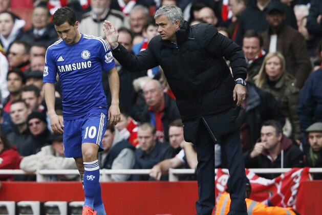 Chelsea's Portuguese manager Jose Mourinho (R) speaks with Chelsea's Belgian midfielder Eden Hazard during the English Premier League football match between Arsenal and Chelsea at the Emirates Stadium in London on April 26, 2015.
AFP PHOTO / ADRIAN DENNIS

RESTRICTED TO EDITORIAL USE. No use with unauthorized audio, video, data, fixture lists, club/league logos or live services. Online in-match use limited to 45 images, no video emulation. No use in betting, games or single club/league/player publications.        (Photo credit should read ADRIAN DENNIS/AFP/Getty Images)