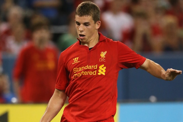 TORONTO, CANADA - JULY 21: John Flanagan #38 of Liverpool passes the ball against Toronto FC during the World Football Challenge friendly match on July 21, 2012 at Rogers Centre in Toronto, Ontario, Canada. (Photo by Tom Szczerbowski/Getty Images)
