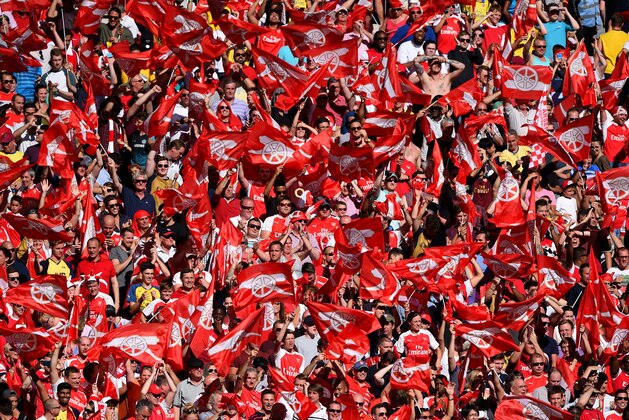 LONDON, ENGLAND - AUGUST 02:  Arsenal supporters celebrate their team's 1-0 win in the FA Community Shield match between Chelsea and Arsenal at Wembley Stadium on August 2, 2015 in London, England.  (Photo by Shaun Botterill/Getty Images)