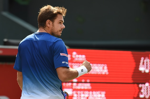 Stan Wawrinka of Switzerland reacts after gaining a point against Radek Stepanek of Czech Republic during their first round match in the Japan Open tennis tournament in Tokyo on October 6, 2015.     AFP PHOTO / Toru YAMANAKA        (Photo credit should read TORU YAMANAKA/AFP/Getty Images)