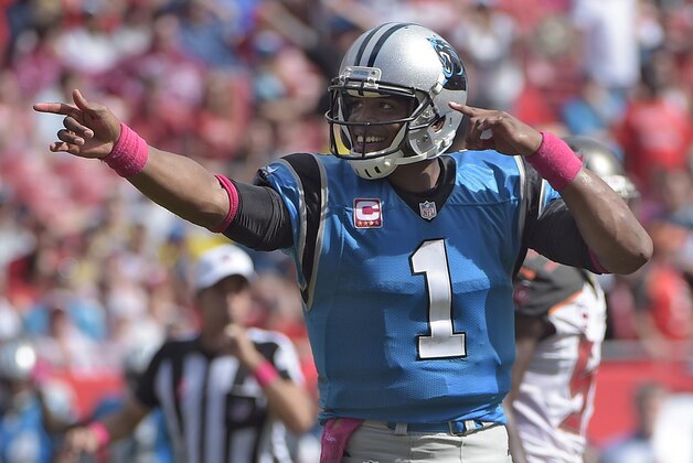 Carolina Panthers quarterback Cam Newton signals first down during the fourth quarter of an NFL football game against the Tampa Bay Buccaneers Sunday, Oct. 4, 2015, in Tampa, Fla. (AP Photo/Phelan M. Ebenhack)