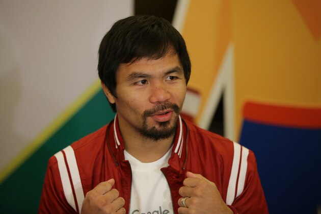 Filipino boxing icon Manny Pacquiao gestures as he answers questions from reporters during an interview in suburban Pasay, south of Manila, Philippines on Wednesday, Sept. 16, 2015. Pacquiao said boxing is not his main focus these days and a rematch with Floyd Mayweather may not happen because the American champion said he was retiring. (AP Photo/Aaron Favila)