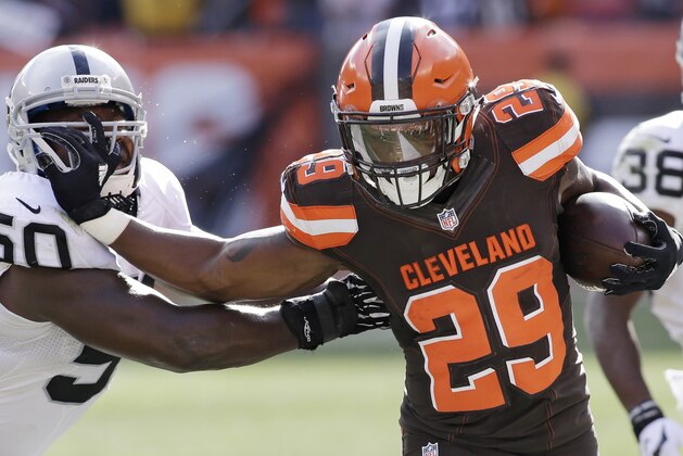 Cleveland Browns running back Duke Johnson (29) stiff-arms Oakland Raiders middle linebacker Curtis Lofton (50) after a catch during the second half of an NFL football game, Sunday, Sept. 27, 2015, in Cleveland. (AP Photo/Aaron Josefczyk)