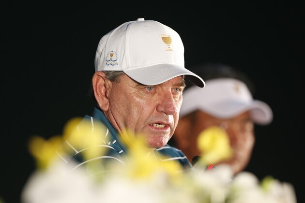 International team captain Nick Price answers reporters' questions during a news conference ahead of the Presidents Cup golf tournament at Jack Nicklaus Golf Club Korea in Incheon, South Korea, Tuesday, Oct. 6, 2015. (AP Photo/Lee Jin-man)