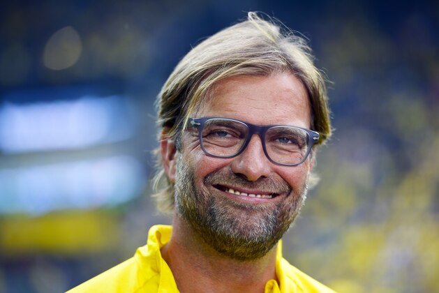 In this Aug. 13, 2014 photo Dortmund's head coach Juergen Klopp smiles during the German soccer Super Cup match between Borussia Dortmund and Bayern Munich in Dortmund. (AP Photo/Sascha Schuermann)