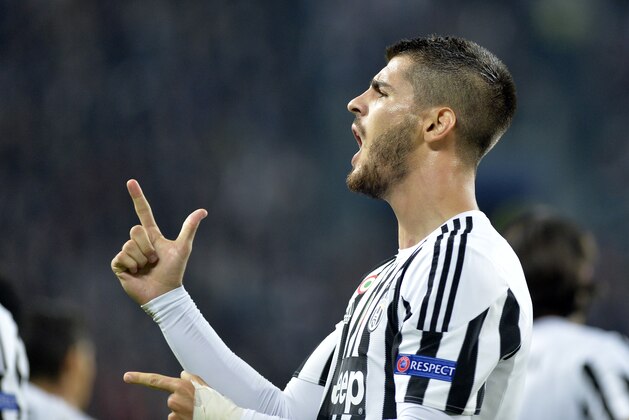 Juventus Alvaro Morata celebrates after he scored during the Champions League group D soccer match between Juventus and FC Sevilla, at the Juventus Stadium in Turin, Italy, Wednesday, Sept. 30, 2015. (AP Photo/Massimo Pinca)