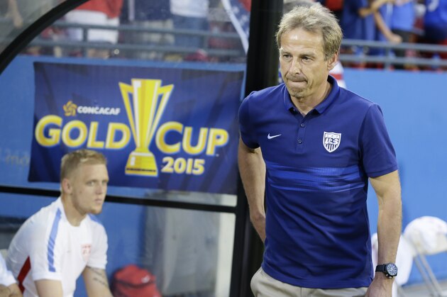 U.S. head soccer coach Jürgen Klinsmann walks onto the field before a CONCACAF Gold Cup opener soccer game against Honduras in Frisco, Texas, Tuesday, July 7, 2015. (AP Photo/LM Otero)