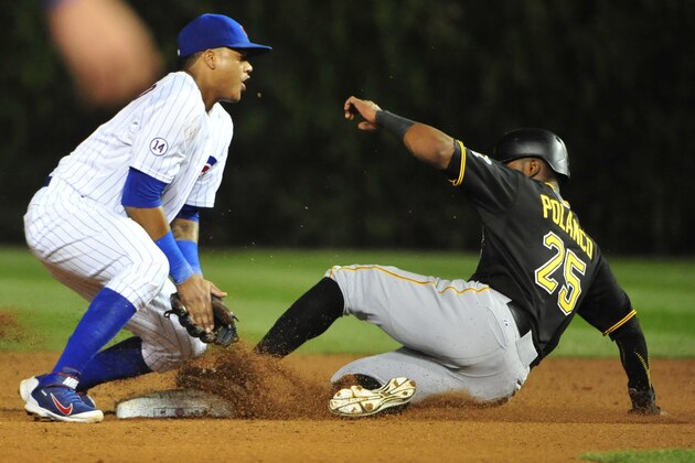 CHICAGO, IL - SEPTEMBER 27:  Gregory Polanco #25 of the Pittsburgh Pirates steals second base on the late tag by Starlin Castro #13 of the Chicago Cubs in the seventh inning on September 27, 2015 at Wrigley Field in Chicago, Illinois. (Photo by David Banks/Getty Images)