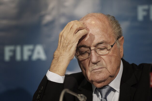 FILE - In this Dec. 19, 2014 file photo FIFA President Sepp Blatter gestures as he attends a press conference in Marrakech, Morocco. (AP Photo/Christophe Ena, file)