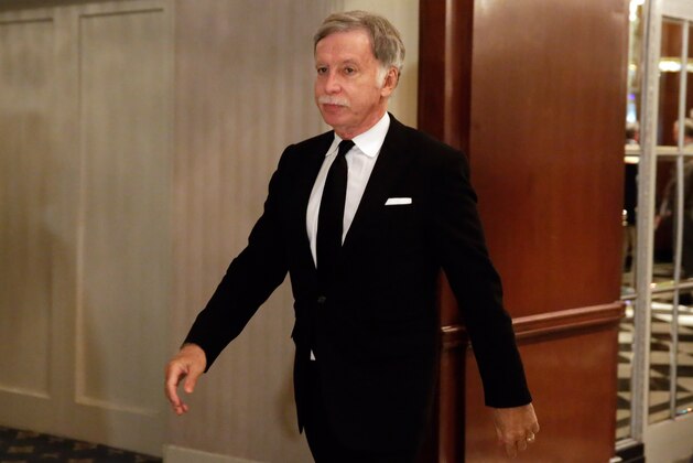 St. Louis Rams owner Stan Kroenke walks in the hallway during a break of National Football League owners meeting, in New York, Wednesday, Oct. 7, 2015. The proposed riverfront stadium in St. Louis has a naming rights deal worth $158 million that hinges on the city having an NFL team when the facility opens. (AP Photo/Richard Drew)