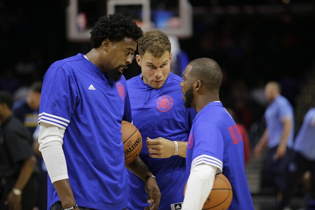 Los Angeles Clippers' DeAndre Jordan, from left, Blake Griffin, Chris Paul chat on the court before an NBA preseason basketball game against the Denver Nuggets, Friday, Oct. 2, 2015, in Los Angeles. (AP Photo/Jae C. Hong)