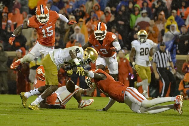 Clemson's Jayron Kearse causes Notre Dame's C.J. Prosise to fumble the ball during the second half of an NCAA college football game Saturday, Oct. 3, 2015,  in Clemson,  S.C.  Clemson won 24-22. (AP Photo/Richard Shiro)