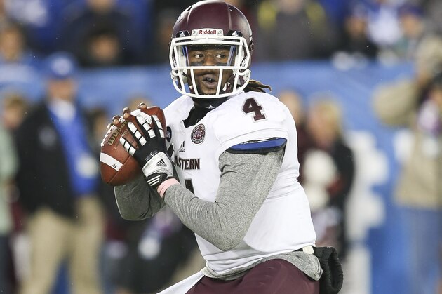 Eastern Kentucky quarterback Bennie Coney looks for a receiver during the first half of an NCAA college football game against Kentucky, Saturday, Oct. 3, 2015, in Lexington, Ky. Kentucky won the game 34-27 in overtime. (AP Photo/David Stephenson)