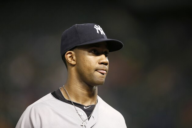 New York Yankees' Chris Young walks to the dugout during a baseball game against the Texas Rangers Tuesday, July 28, 2015, in Arlington, Texas. (AP Photo/Tony Gutierrez)