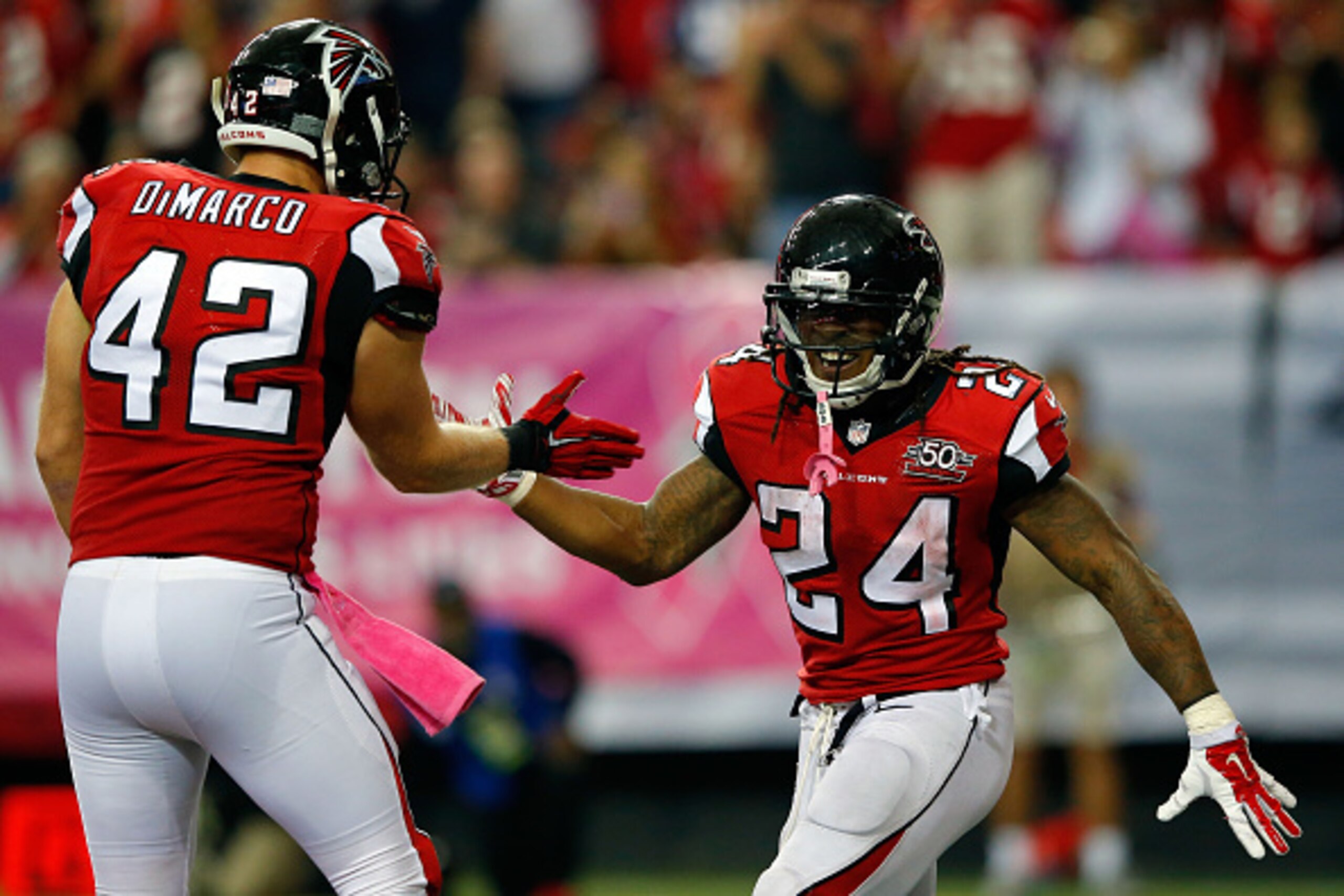 ATLANTA, GA - OCTOBER 04:  Devonta Freeman #24 of the Atlanta Falcons celebrates a touchdown with Patrick DiMarco #42 in the second half against the Houston Texans at the Georgia Dome on October 4, 2015 in Atlanta, Georgia.  (Photo by Kevin C. Cox/Getty Images)