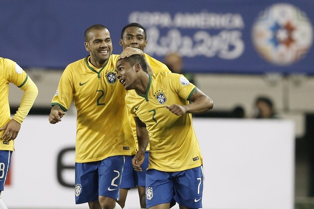 Brazil's Douglas Costa, right, celebrates his goal against Peru with teammate Brazil's Dani Alves, left, during a Copa America Group C soccer match at the German Becker stadium in Temuco, Chile, Sunday, June 14, 2015. (AP Photo/Silvia Izquierdo) Brazil's Douglas Costa, right, celebrates his goal against Peru with teammate Brazil's Dani Alves, left, during a Copa America Group C soccer match at the German Becker stadium in Temuco, Chile, Sunday, June 14, 2015. (AP Photo/Silvia Izquierdo)