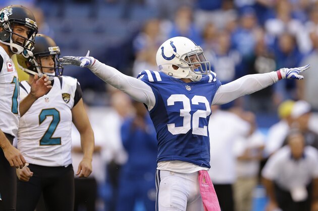 Indianapolis Colts' Colt Anderson (32) celebrates as Jacksonville Jaguars' Jason Myers (2) misses a game winning field goal during overtime of an NFL football game Sunday, Oct. 4, 2015, in Indianapolis. Indianapolis won 16-13 in overtime. (AP Photo/Michael Conroy)