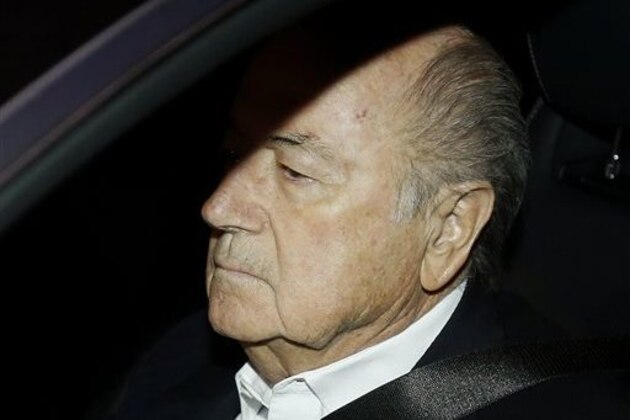 FIFA President Sepp Blatter drives his car into the garage of the FIFA headquarters on his way to work in Zurich, Switzerland, Tuesday, Sept. 29, 2015. Blatter was questioned by Swiss investigators on Friday about why FIFA paid 2 million Swiss francs (about $2 million) to UEFA President Michel Platini in 2011 for work supposedly carried out at least nine years earlier. (AP Photo/Michael Probst)