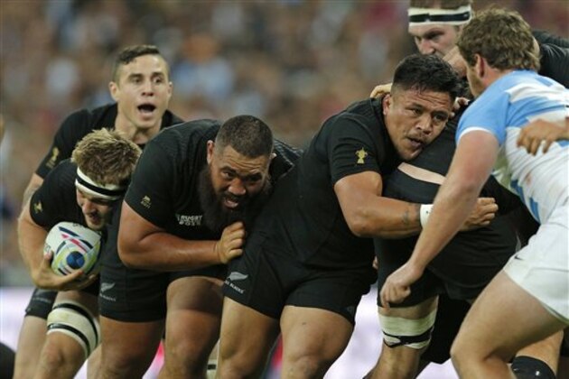 New Zealand's Sam Cane, left, holds the ball at the back of a rolling maul during the Rugby World Cup Pool C match between Argentina and New Zealand at Wembley stadium in London, Sunday, Sept. 20, 2015. (AP Photo/Christophe Ena)