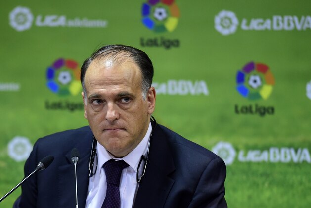 President of the Spanish professional football league Javier Tebas looks on as he gives a press conference at Spanish Liga headquarters in Madrid on May 11, 2015. Spain's football league launched a lawsuit on May 8, 2015 to block a strike threatened by players that it warned could cost 50 million euros ($56 million) per match day in lost revenues.   AFP PHOTO/ GERARD JULIEN        (Photo credit should read GERARD JULIEN/AFP/Getty Images)