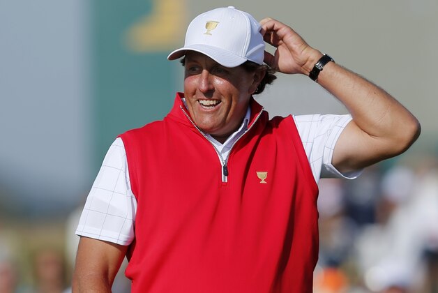 United States' Phil Mickelson reacts to his putt on the 17th green during his foursome match at the Presidents Cup golf tournament at the Jack Nicklaus Golf Club Korea, in Incheon, South Korea, Thursday, Oct. 8, 2015.(AP Photo/Woohae Cho)