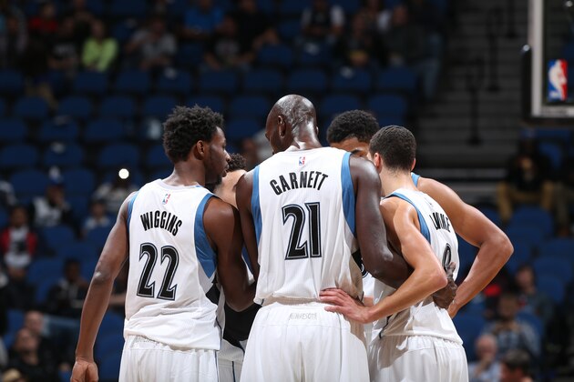 MINNEAPOLIS, MN - OCTOBER 7: Kevin Garnett #21 and Andrew Wiggins #22 of the Minnesota Timberwolves huddle with the team during a preseason game against the Oklahoma City Thunder on October 7, 2015 at Target Center in Minneapolis, Minnesota. NOTE TO USER: User expressly acknowledges and agrees that, by downloading and or using this Photograph, user is consenting to the terms and conditions of the Getty Images License Agreement. Mandatory Copyright Notice: Copyright 2015 NBAE (Photo by David Sherman/NBAE via Getty Images)