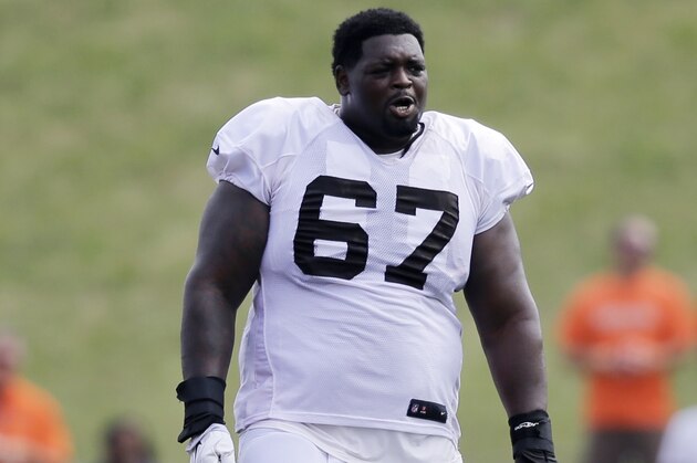 Cleveland Browns defensive end Ishmaa'ily Kitchen watches during practice at the NFL football team's training camp Monday, Aug. 10, 2015, in Berea, Ohio. (AP Photo/Tony Dejak)