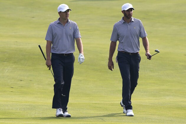 United States' Jordan Spieth, left, walks with teammate Dustin Johnson during their final practice round ahead of the Presidents Cup golf tournament at the Jack Nicklaus Golf Club Korea, in Incheon, South Korea, Wednesday, Oct. 7, 2015.(AP Photo/Lee Jin-man)