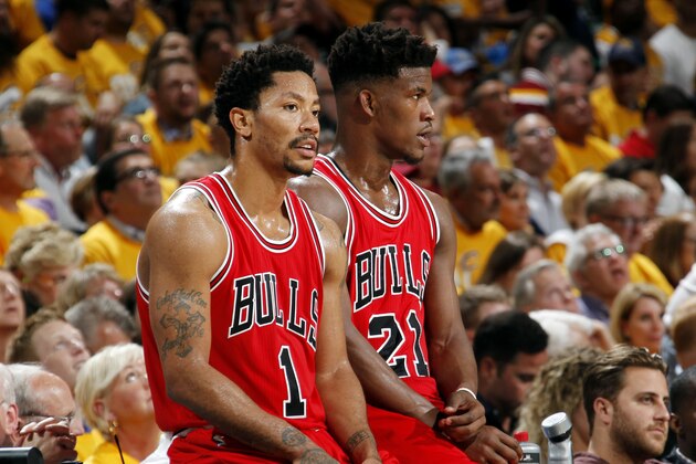 CLEVELAND, OH - MAY 4: Derrick Rose #1 and Jimmy Butler #21 of the Chicago Bulls wait to check into the game against the Cleveland Cavaliers in Game One of the Eastern Conference Semifinals of the NBA Playoffs at The Quicken Loans Arena on May 4, 2015 in Cleveland, Ohio. NOTE TO USER: User expressly acknowledges and agrees that, by downloading and/or using this Photograph, user is consenting to the terms and conditions of the Getty Images License Agreement. Mandatory Copyright Notice: Copyright 2015 NBAE (Photo by Gregory Shamus/NBAE via Getty Images)