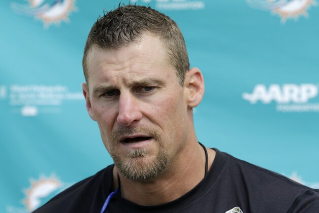 Miami Dolphins interim coach Dan Campbell talks to to reporters after NFL football practice Wednesday, Oct. 7, 2015, in Davie, Fla. (AP Photo/Alan Diaz)