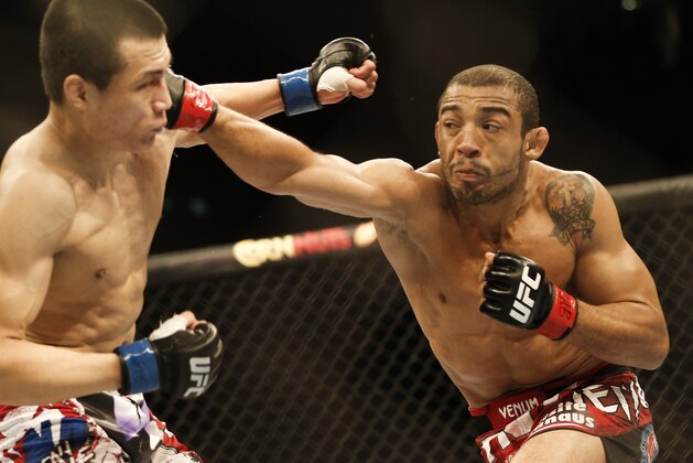 Jose Aldo, from Brazil, right, and Chan Sung Jung, from South Korea, battle during their UFC 163 mixed martial arts Featherweight Championship bout in Rio de Janeiro, Brazil, Sunday, Aug. 4, 2013. Aldo defeated Jung and kept his Championship belt. (AP Photo/Felipe Dana)