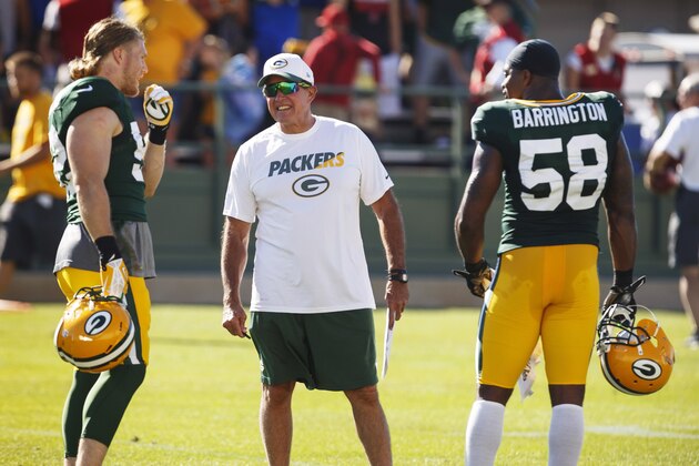 Green Bay Packers defensive coordinator Dom Capers talks with Clay Matthews, left, and Sam Barrington during NFL football training camp, Saturday, Aug. 1 , 2015, in Green Bay, Wis. (AP Photo/Mike Roemer)