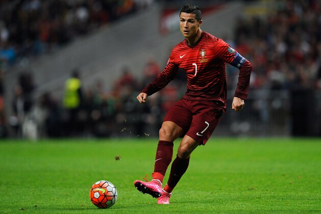 Portugal’s Cristiano Ronaldo passes the ball during the Euro 2016 qualifying group I soccer match between Portugal and Denmark at the Municipal Stadium in Braga, Portugal, Thursday, Oct. 8 2015. (AP Photo/Paulo Duarte)