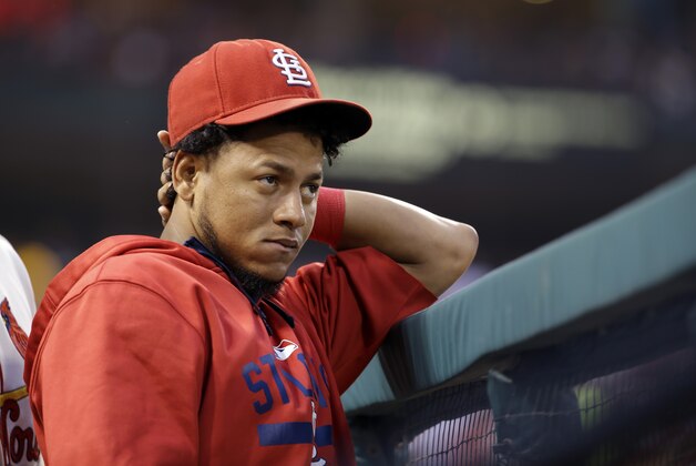 St. Louis Cardinals starting pitcher Carlos Martinez stands in the dugout during the first inning of a baseball game against the Milwaukee Brewers on Saturday, Sept. 26, 2015, in St. Louis. Martinez is expected to miss the rest of the season due to a right shoulder strain. (AP Photo/Jeff Roberson)