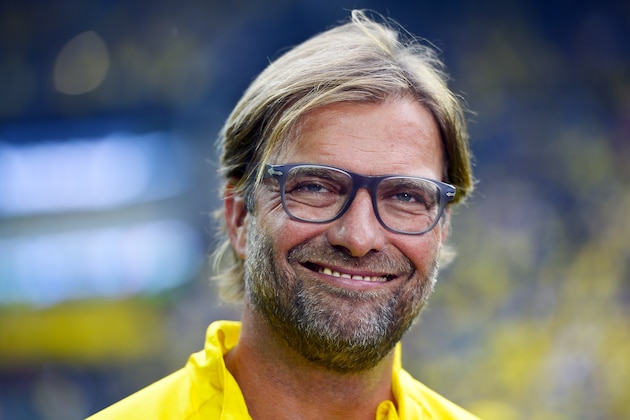 In this Aug. 13, 2014 photo Dortmund's head coach Juergen Klopp smiles during the German soccer Super Cup match between Borussia Dortmund and Bayern Munich in Dortmund. (AP Photo/Sascha Schuermann)