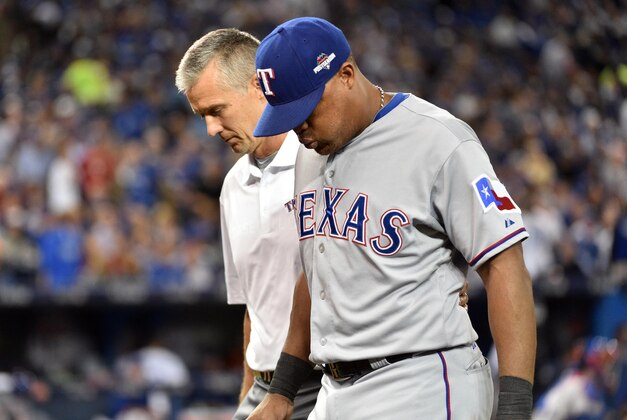 Oct 8, 2015; Toronto, Ontario, CAN; Texas Rangers third baseman Adrian Beltre is helped off the field in the third inning after an injury sustained against the Toronto Blue Jays in game one of the ALDS at Rogers Centre. Mandatory Credit: Nick Turchiaro-USA TODAY Sports