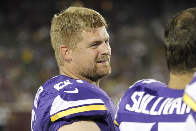 Minnesota Vikings center Joe Berger (61) talks with a teammate in the second half of a preseason NFL football game against the Tampa Bay Buccaneers at TCF Bank Stadium Saturday, Aug. 15, 2015, in Minneapolis. (AP Photo/Ann Heisenfelt)