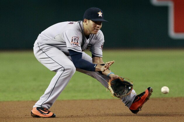 Houston Astros shortstop Carlos Correa fields a ground ball against the Arizona Diamondbacks during the second inning of a baseball game, Sunday, Oct. 4, 2015, in Phoenix. The Diamondbacks defeated the Astros 5-3. (AP Photo/Ralph Freso)