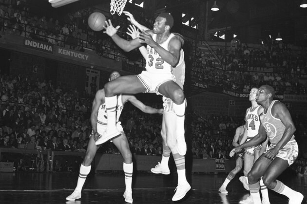 Bill Bridges of the St. Louis Hawks jumps high in the air to surround a rebound during the first period of the Hawks Western Division Playoff game against the San Francisco Warriors in St. Louis, on Sunday, April 1, 1968. Zelmo Beaty is ready to offer help if help is needed. The Hawks didn’t need any help; they whipped the warriors 129-103 at the Washington University Field House. But the Warriors still hold a 3-2 edge in the best of seven series. (AP Photo)