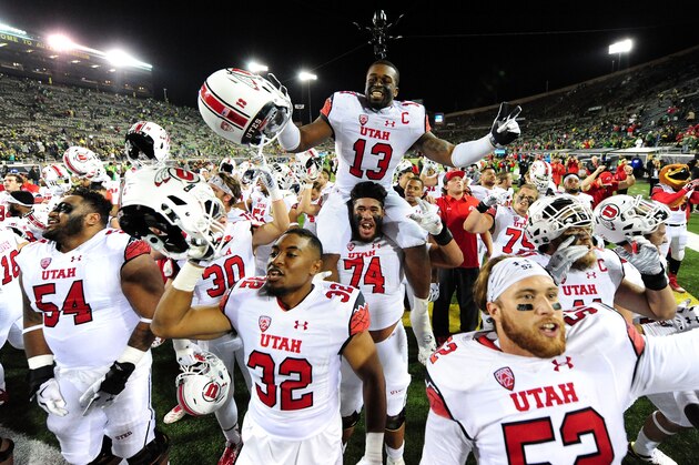 EUGENE, OR - SEPTEMBER 26: Running back Monte Seabrook #13 of the Utah Utes sits on the shoulders of offensive lineman Salesi Uhatafe #74 of the Utah Utes as the team celebartes with fans after the Utah Utes beat the Oregon Ducks 62-20 at Autzen Stadium on September 26, 2015 in Eugene, Oregon.  (Photo by Steve Dykes/Getty Images)