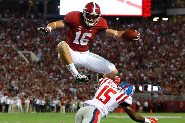 TUSCALOOSA, AL - SEPTEMBER 19:  Richard Mullaney Richard Mullaney #16 of the Alabama Crimson Tide leaps over Kendarius Webster #15 of the Mississippi Rebels on the way to a touchdown at Bryant-Denny Stadium on September 19, 2015 in Tuscaloosa, Alabama.  (Photo by Kevin C. Cox/Getty Images)