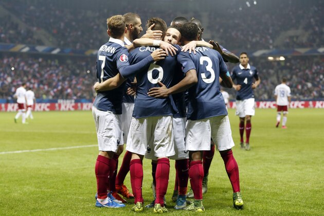 France's midfielder Yohan Cabaye (C) celebrates with teammates after scoring a goal during the friendly football match between France and Armenia on October 8, 2015 at the Allianz Riviera stadium in Nice, southeastern France. AFP PHOTO / VALERY HACHE        (Photo credit should read VALERY HACHE/AFP/Getty Images)